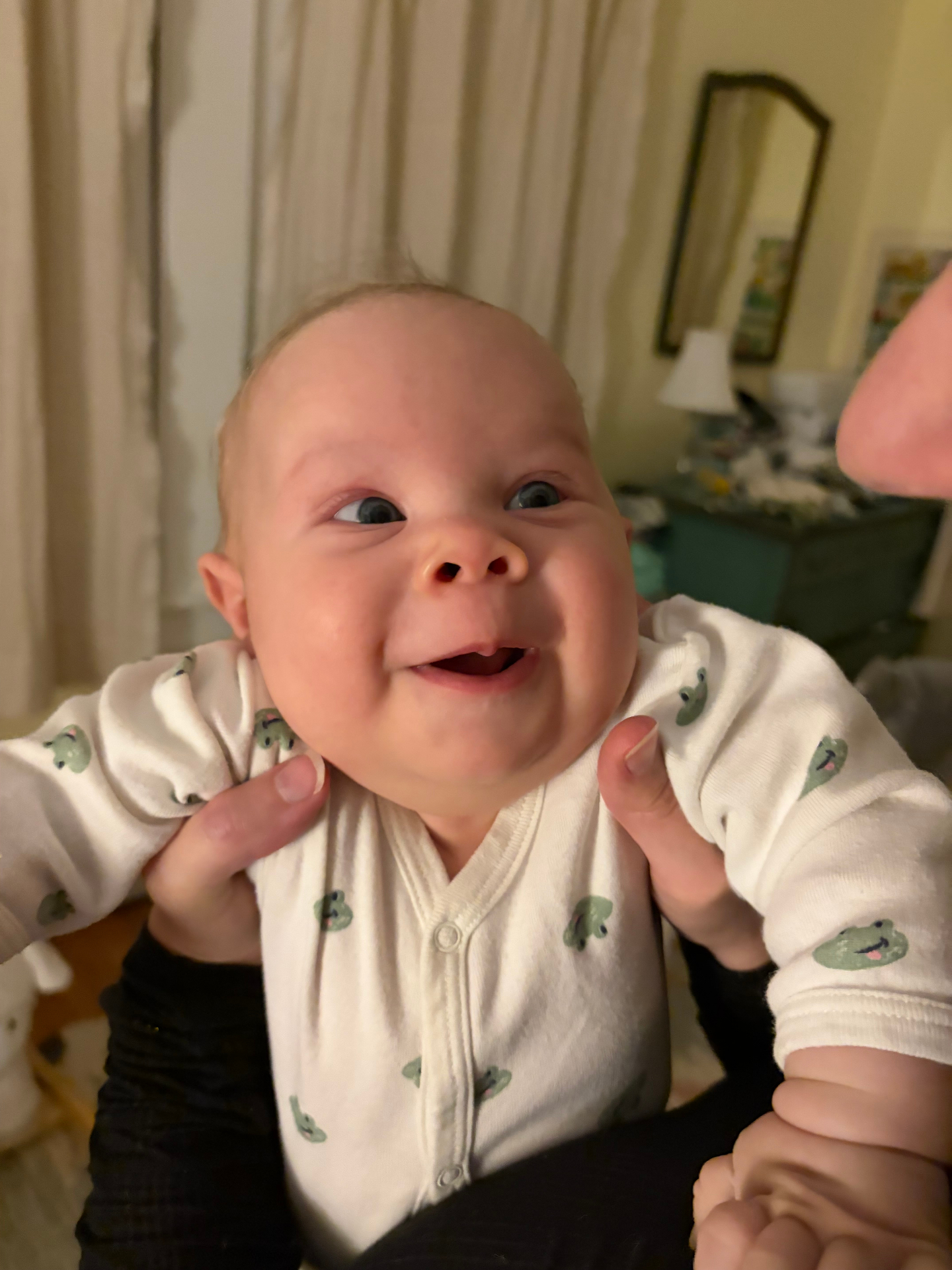 Oren grinning in frog pajamas