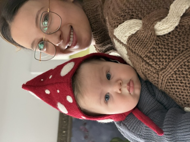 Oren in a mushroom hat with Noa